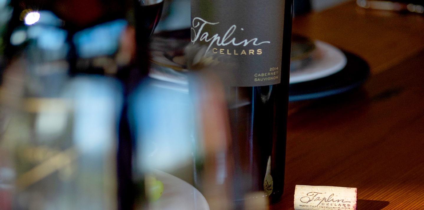 Taplin wines header background with wine bottles